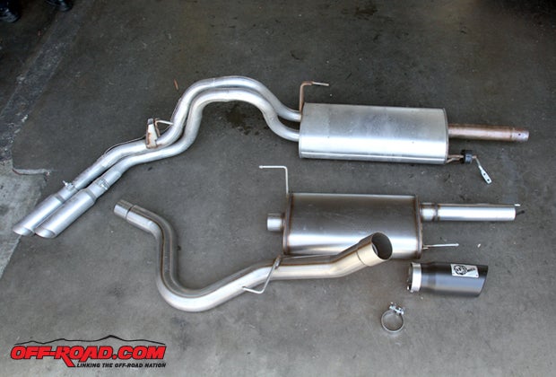 The aFe cat-back exhaust (bottom) replaces the stock Ford Raptor exhaust (top), replacing the dual-pipe exit with a larger one-piece tail pipe. 