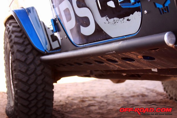 Trail Jeeps used TNT Customs JK Guardian rock sliders on the Polar JK.  Blackie puts them to the test in Moab, only a few scratches after gliding over red rock.