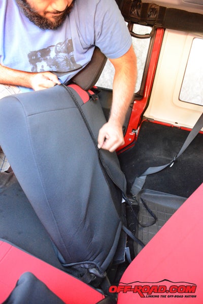 Heavy-duty zippers, wide Velcro strips and under-seat straps secure it in place.