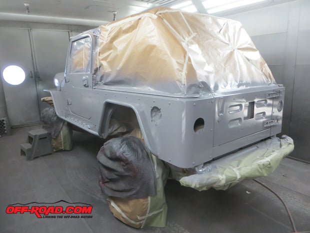 With masking in place, primer was applied all over the Jeep so the urethane finish would be perfect.