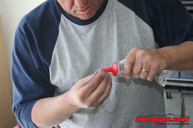 To be doubly safe, we also applied silicone sealer to the T-nut before inserting it in the hole.