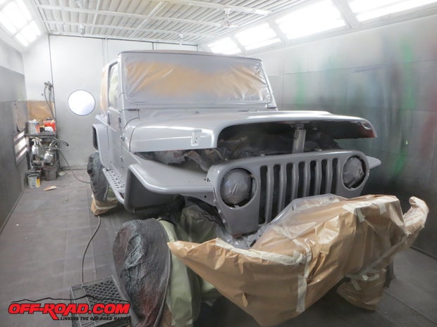 The grille and under the hood were also covered with primer.