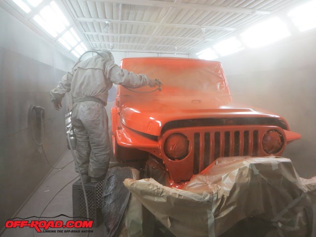Starting at the frontso the under-hood areas and grille top could be covered firstthe entire Jeep was given the first coat.