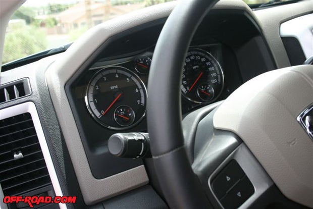 19.	Both trucks are equipped with the same smart wheel and dashboard, although the 1500 gear shift is in the center console and the 2500 gear shifter is on the steering column, which allows the manual transfer case shifter to be in the center console.