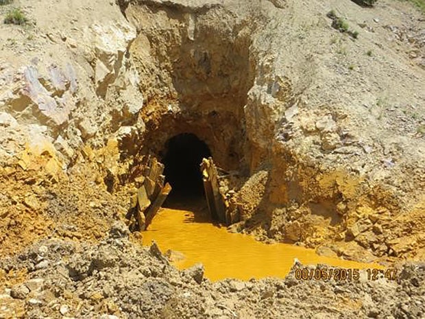 Historic mines become less stable over time; backhoes and mine-to-mine overflow do not help. This photo was taken shortly after mine had drained. Photo: Business Insider, August 17, 2015.