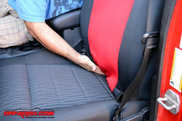 The seat covers have a bottom flap that is tucked in-between the seat cushions so they can be attached from behind the seat.