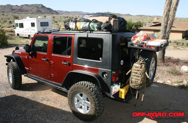 All packed and ready for a weekend at the river, the recycled roof rack and Bestop rear luggage rack combined to allow room for two passengers in the rear seat. And, since the rack doesnt start until the B pillar, it still allows the Jeep to go lidless over the cockpit.
