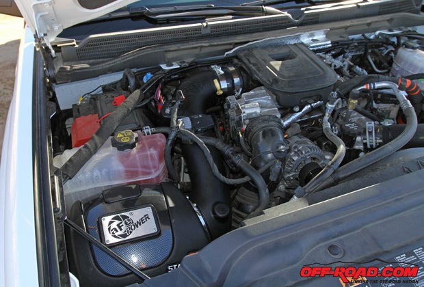 The 6.6-liter Duramax turbo-diesel engine is fitted with an aFe Elite Pro-Dry Stage 2 Intake System.